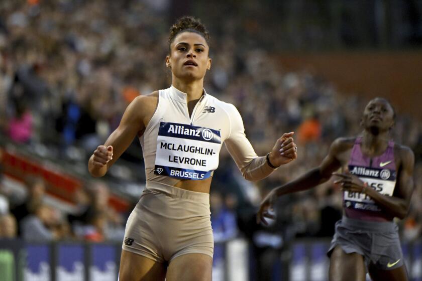 FILE - Sydney Mclaughlin-Levrone, of the United States, crosses the finish line.