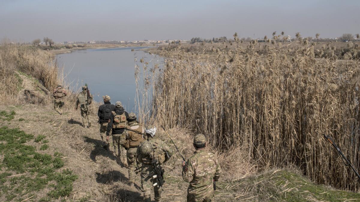 An Iraqi Emergency Response Division unit advances along the Tigris River to the southernmost Islamic State-occupied neighborhoods of west Mosul.