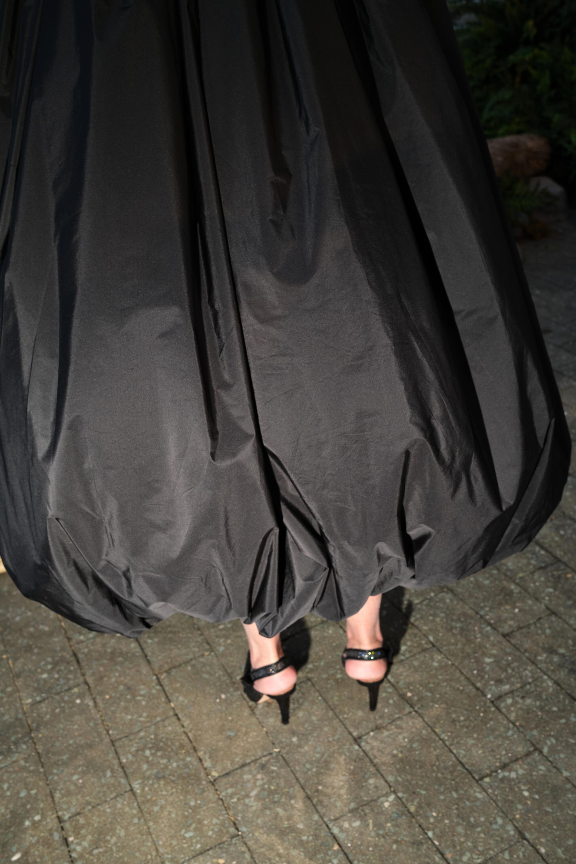 A black gown and shoes.