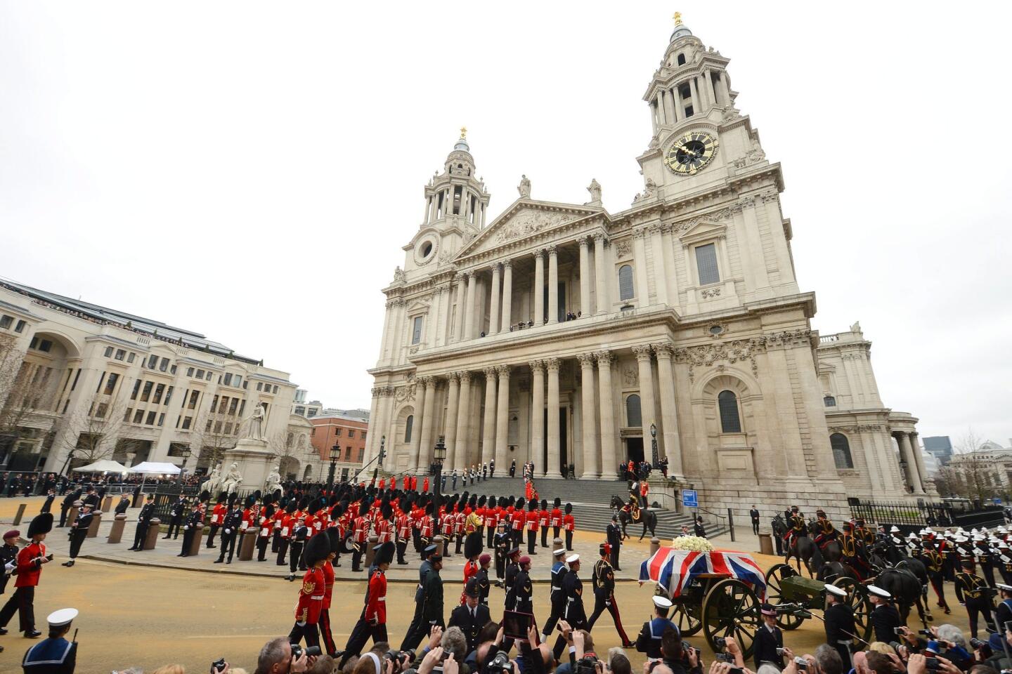 The scene outside St. Paul's Cathedral in central London as a gun carriage brings the coffin of former British Prime Minister Margaret Thatcher.