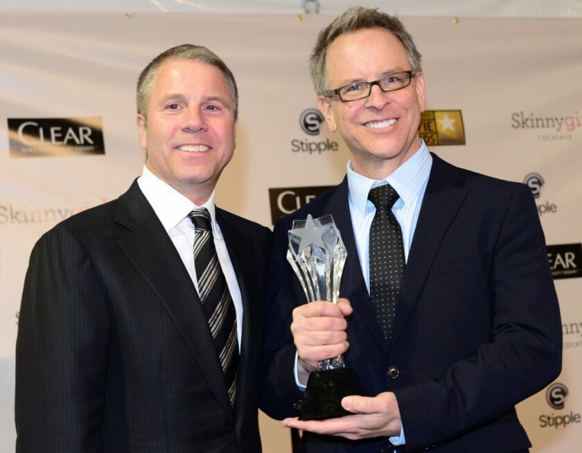 "Wreck-It Ralph" director Rich Moore, right, and producer Clark Spencer celebrate at the Critics Choice awards, one of several prizes they've picked up during the awards season. Will Oscar be next?