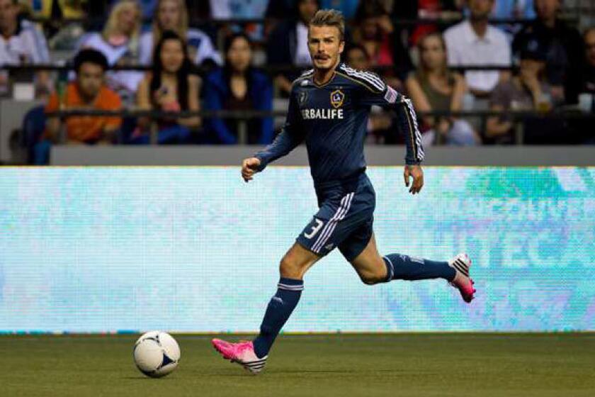 David Beckham controls the ball for the L.A. Galaxy from a game earlier this season.