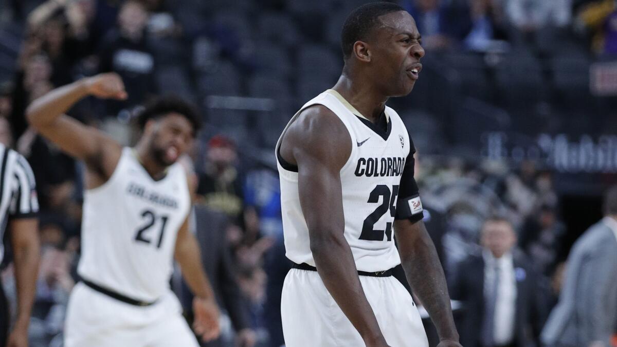 Colorado's McKinley Wright IV celebrates after a play against California during the first half of a game in the first round of the Pac-12 men's tournament on Wednesday in Las Vegas.