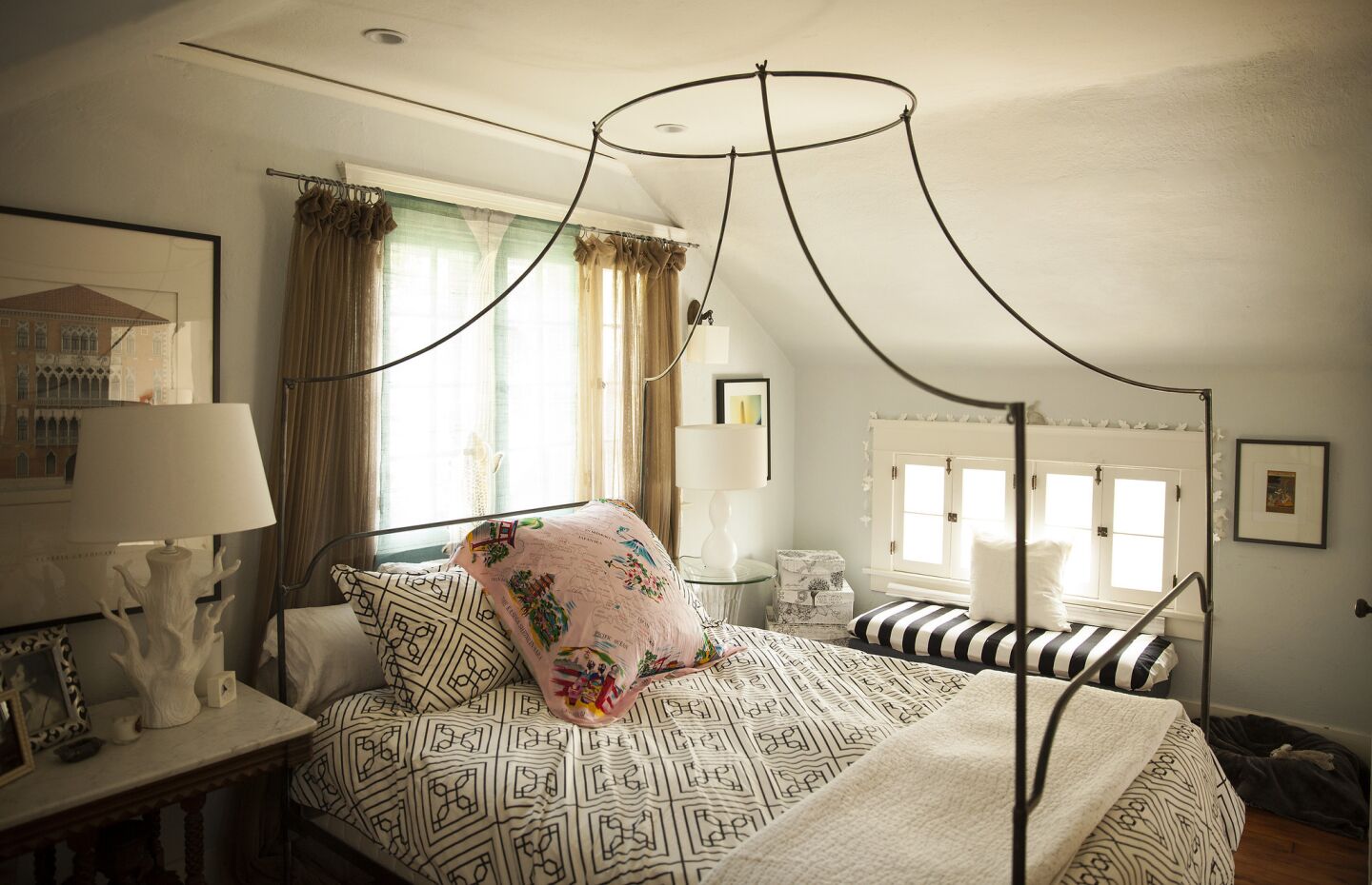 In the bedroom, the roofline and period windows hint at the Garvanza home's Victorian roots.
