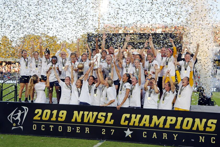 The North Carolina Courage celebrate with the championship trophy following their win over the Chicago Red Stars in an NWSL championship soccer game in Cary, N.C., Sunday, Oct. 27, 2019. (AP Photo/Karl B DeBlaker)