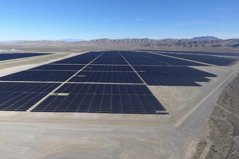 Solar arrays line the desert floor of the Dry Lake Solar Energy Zone as part of the 179 megawatt (MW) Switch Station 1 and Switch Station 2 Solar Projects north of Las Vegas that were commissioned on Monday, Dec. 11, 2017. (Michael Quine/Las Vegas Review-Journal via AP)