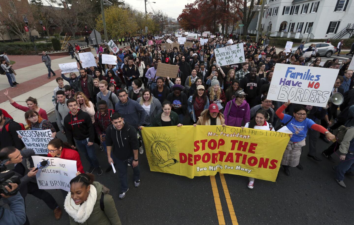 Hundreds of Rutgers University students march to protest President-elect Donald Trump's policies and to ask school officials to denounce his plans on Wednesday, Nov. 16, 2016, in New Brunswick, N.J.