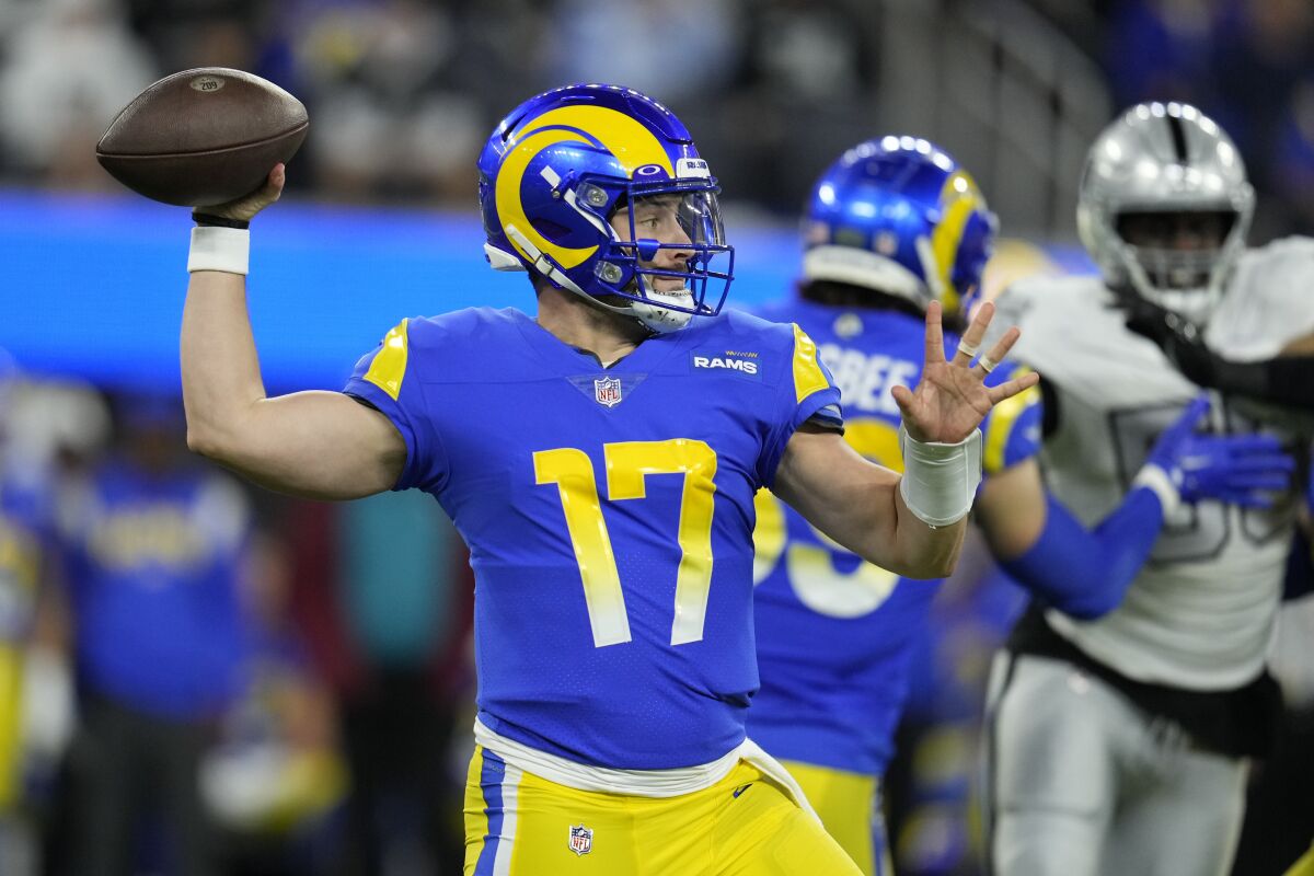 Rams quarterback Baker Mayfield throws a pass against the Raiders in the first half.