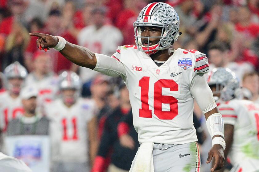 Ohio State quarterback J.T. Barrett gestures during the 2016 PlayStation Fiesta Bowl against Clemson on Dec. 31, 2016 in Glendale, Ariz.