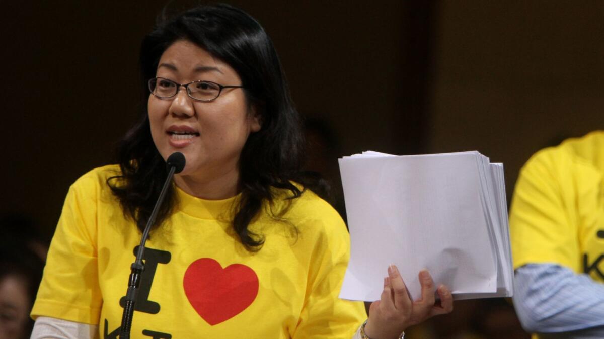 Korean American lawyer and activist Grace Yoo protests a gerrymandering of Los Angeles City Council districts that diluted Koreatown's political voice in 2012. Yoo later ran for a council seat and lost to incumbent Herb Wesson.
