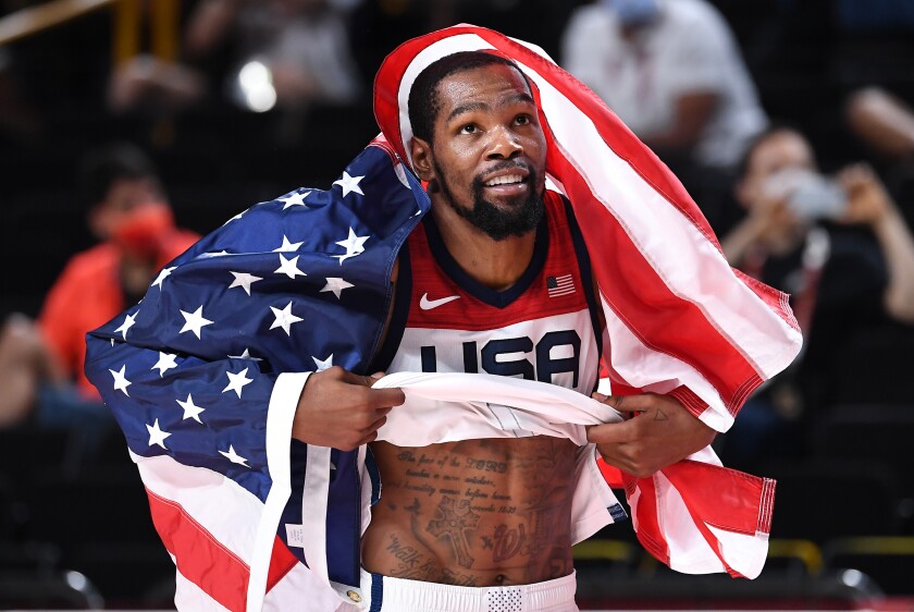 U.S. men's basketball forward Kevin Durant celebrates after winning an Olympic gold medal.