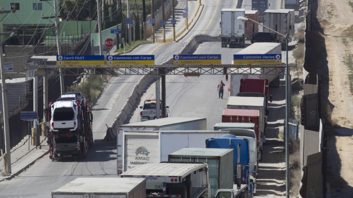 Trucks in Mexico approach the Otay Mesa Port of Entry.
