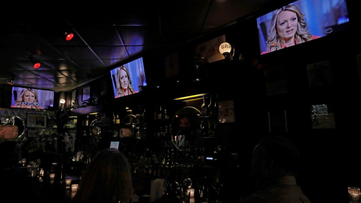 Anderson Cooper's interview with Stormy Daniels on "60 Minutes" on Sunday became a major television event. It was shown on all TV screens at New York's Hi Life Bar & Grill.