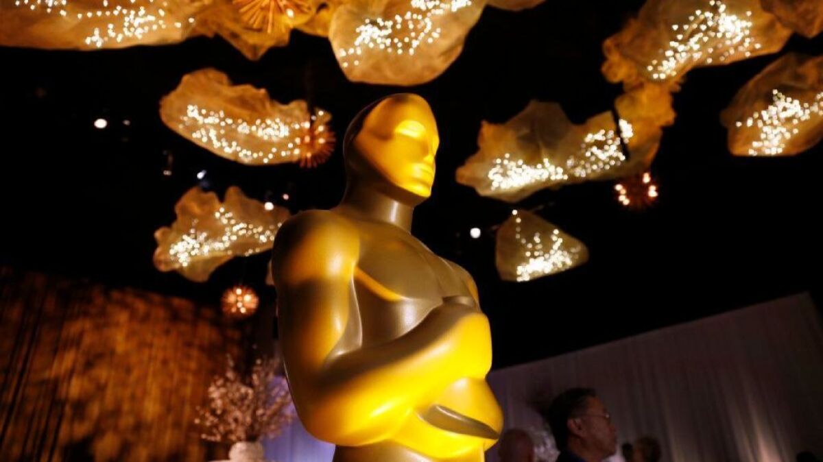 Oscar statue under the ceiling artwork that is featured through the Ray Dolby Ballroom for the 89th Oscars Governors Ball.