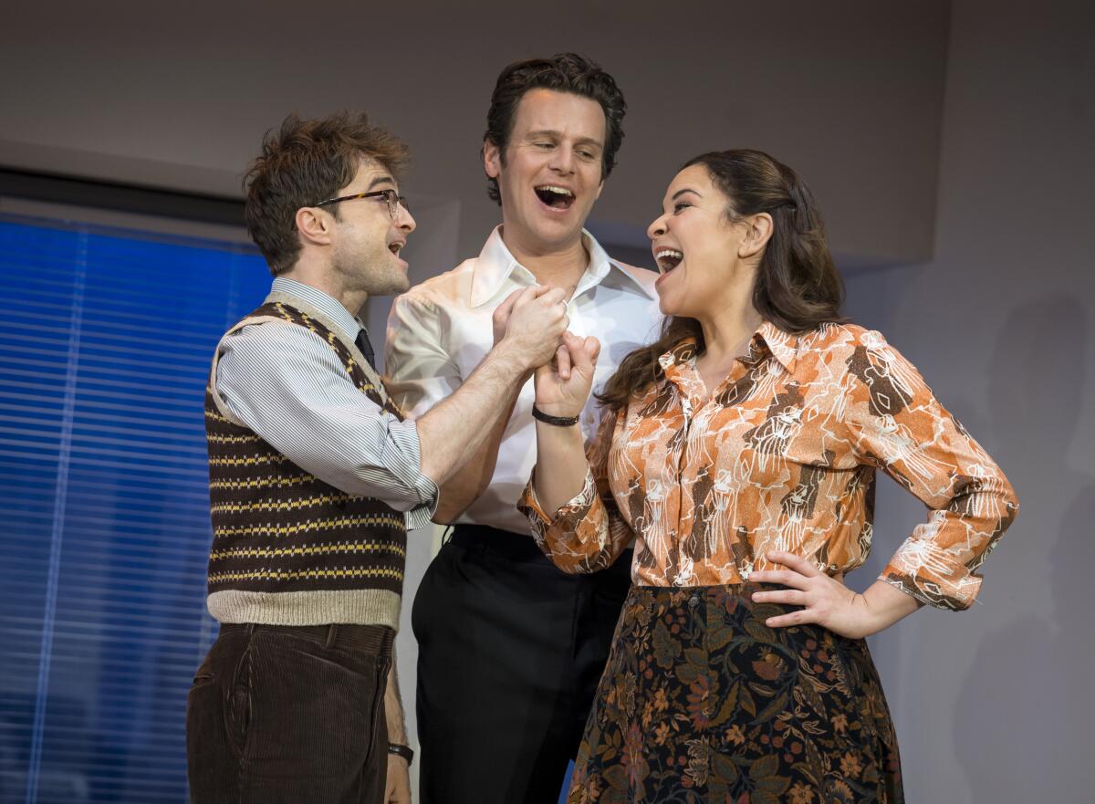 "Merrily We Roll Along" at New York Theatre Workshop with Daniel Radcliffe, left, Jonathan Groff and Lindsay Mendez.