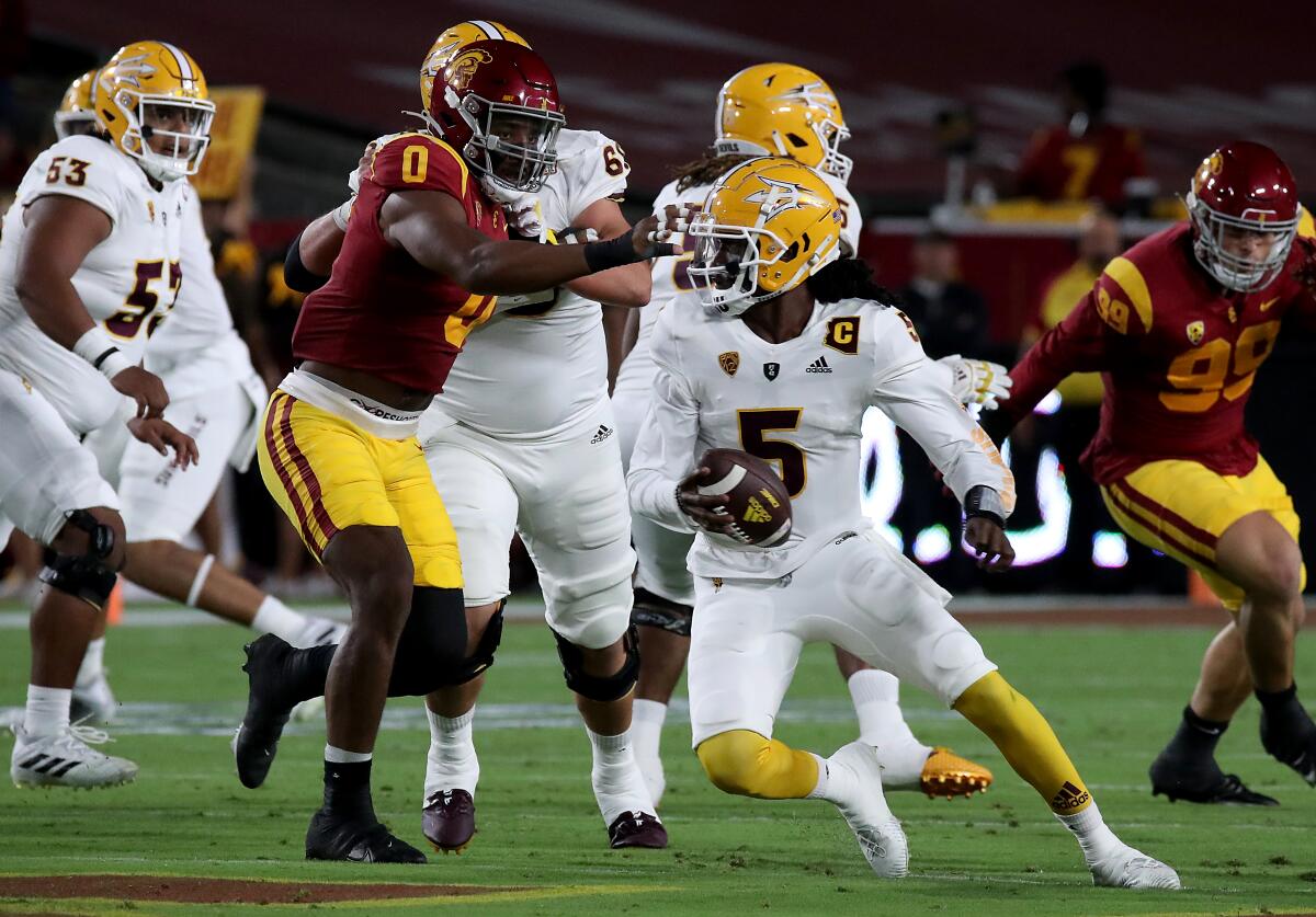 USC's Korey Foreman flushes Arizona State's Emory Jones out of the pocket