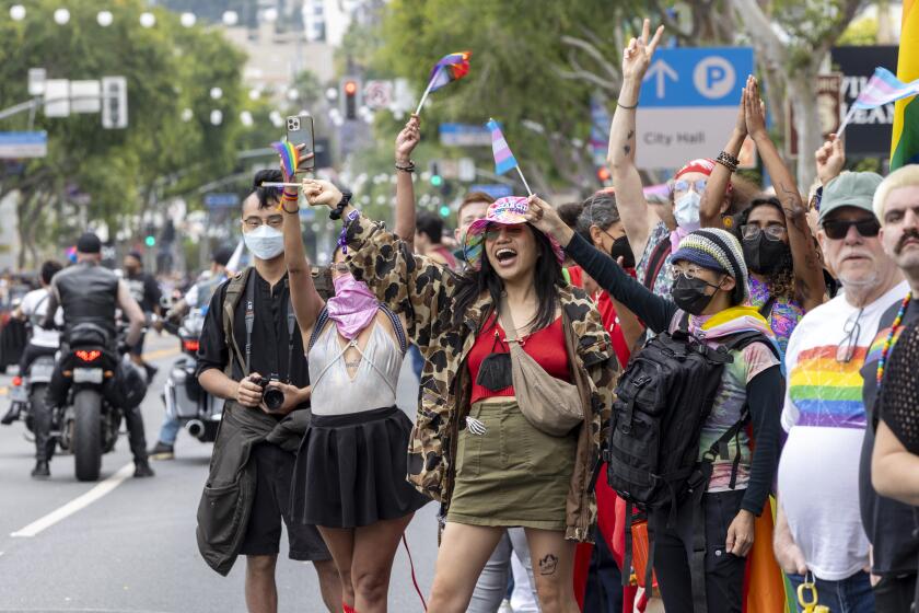Los Angeles, CA - June 02: Parade attendies cheer on participants at the 2024 West Hollywood Pride Parade Los Angeles, CA. (Zoe Cranfill / Los Angeles Times)