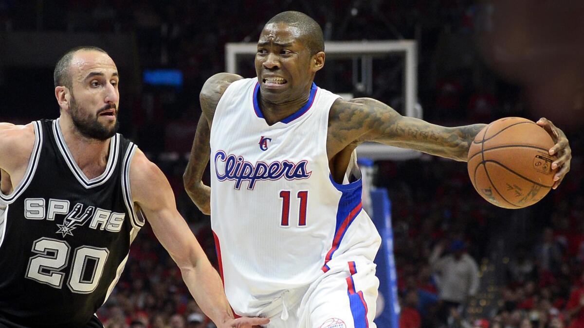 Clippers guard Jamal Crawford, right, drives past San Antonio Spurs guard Manu Ginobili during Game 7 of the Western Conference quarterfinals on April 19, 2015.