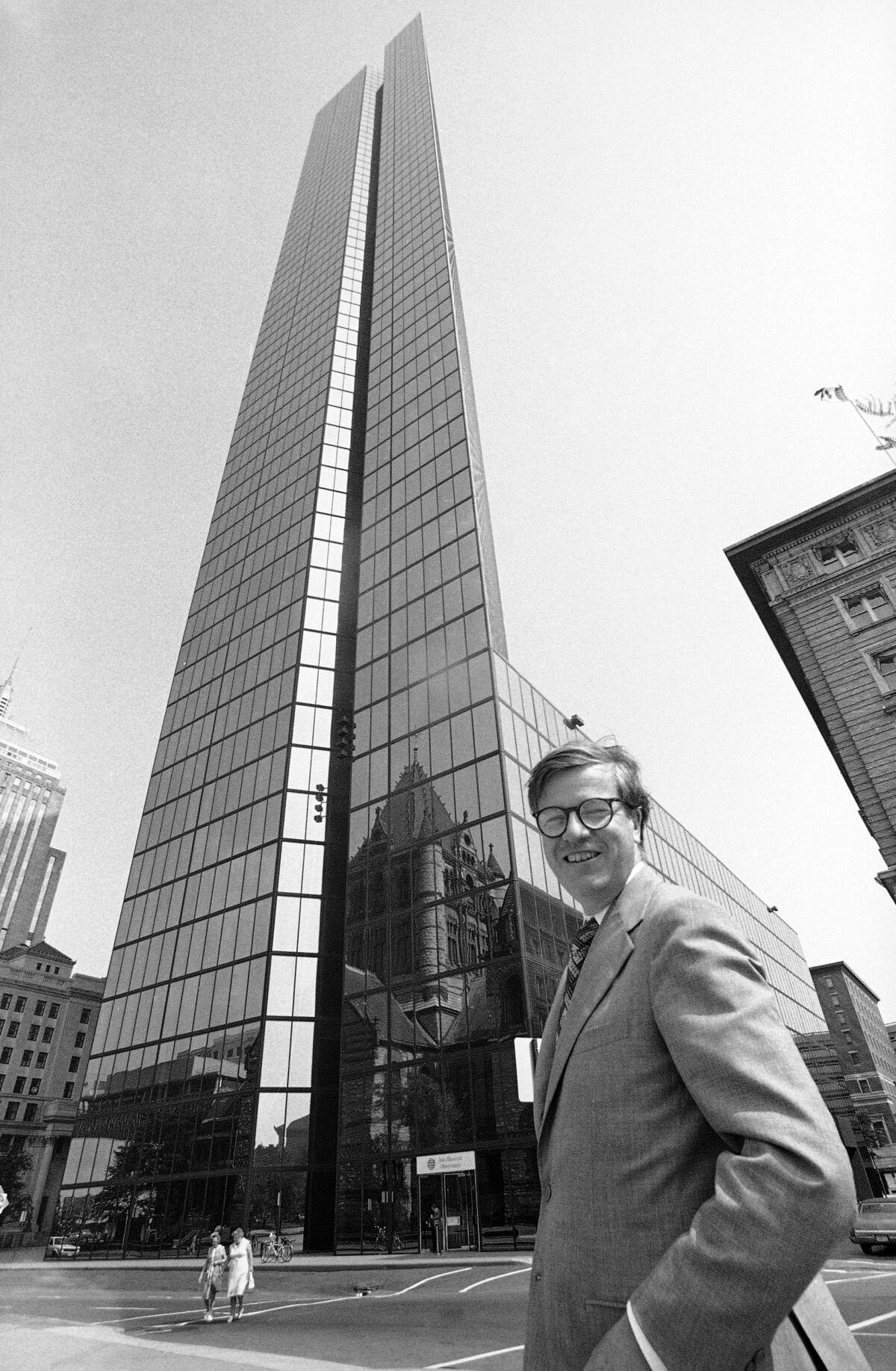 Architect Henry Cobb stands across the street from the John Hancock Tower in Boston in 1977.