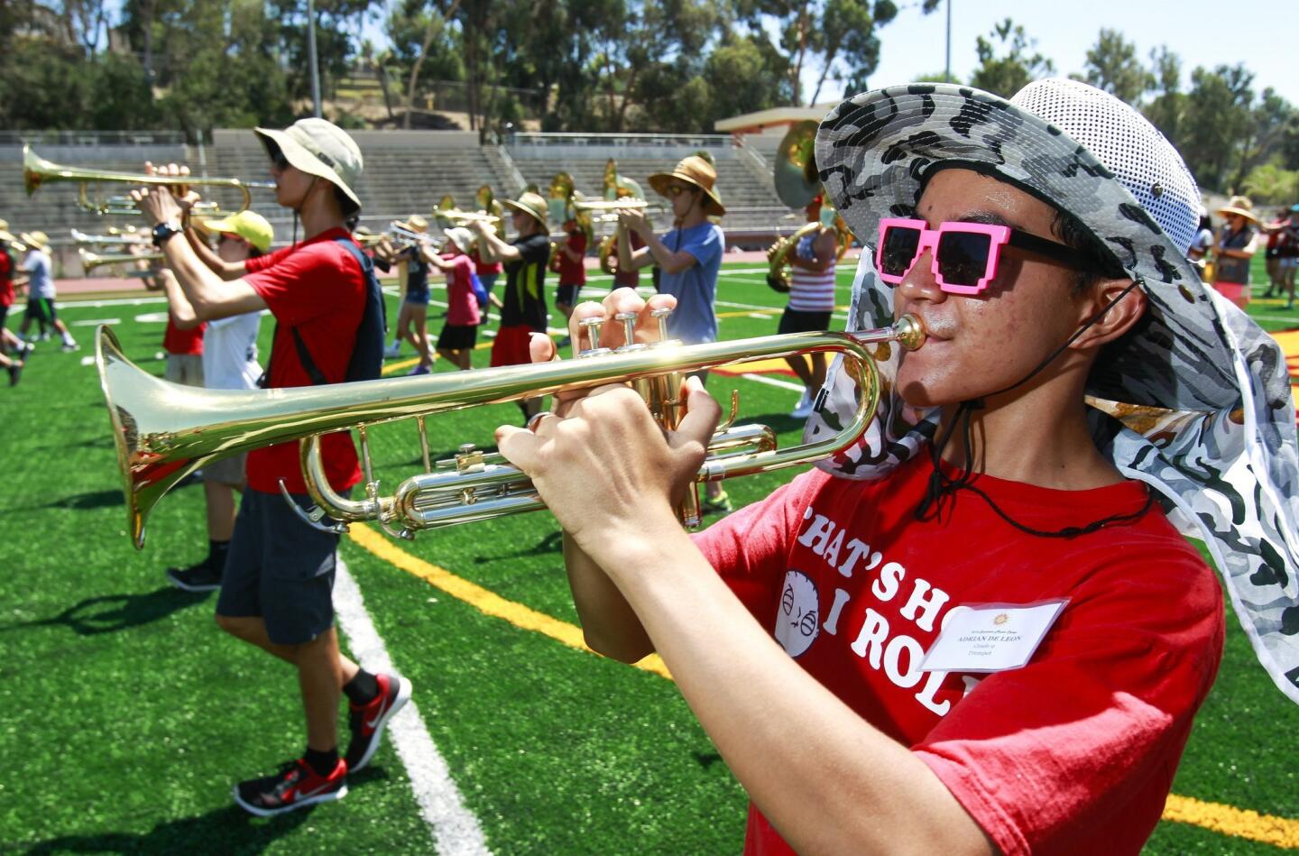 Ninth grader Adrian De Leon plays the trumpet.