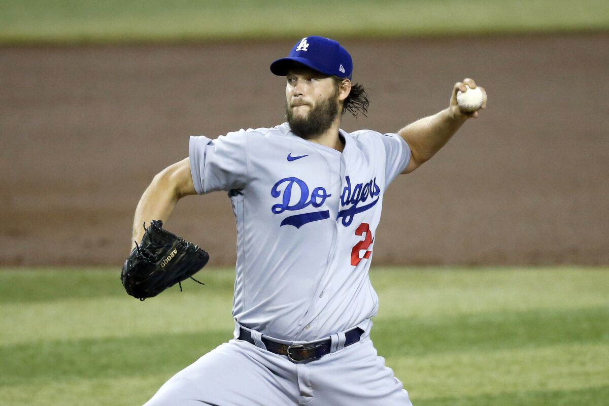 Los Angeles Dodgers starting pitcher Clayton Kershaw throws against the Arizona Diamondbacks during the first inning of a baseball game Sunday, Aug. 2, 2020, in Phoenix. (AP Photo/Ross D. Franklin)