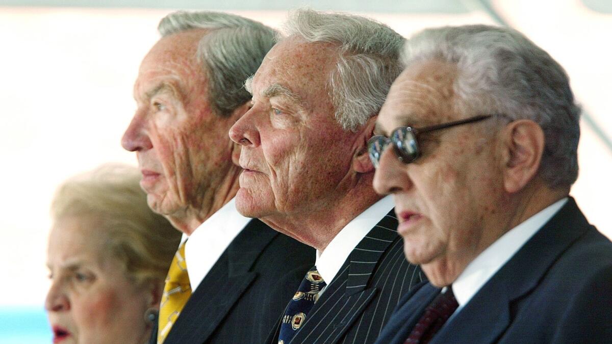 Former U.S. secretaries of State, from left, Madeleine Albright, Warren Christopher, Alexander Hai, and Henry Kissinger take part in the dedication and naming ceremony of the George P. Shultz National Foreign Affairs Training Center in Arlington, Va., on May 29, 2002.