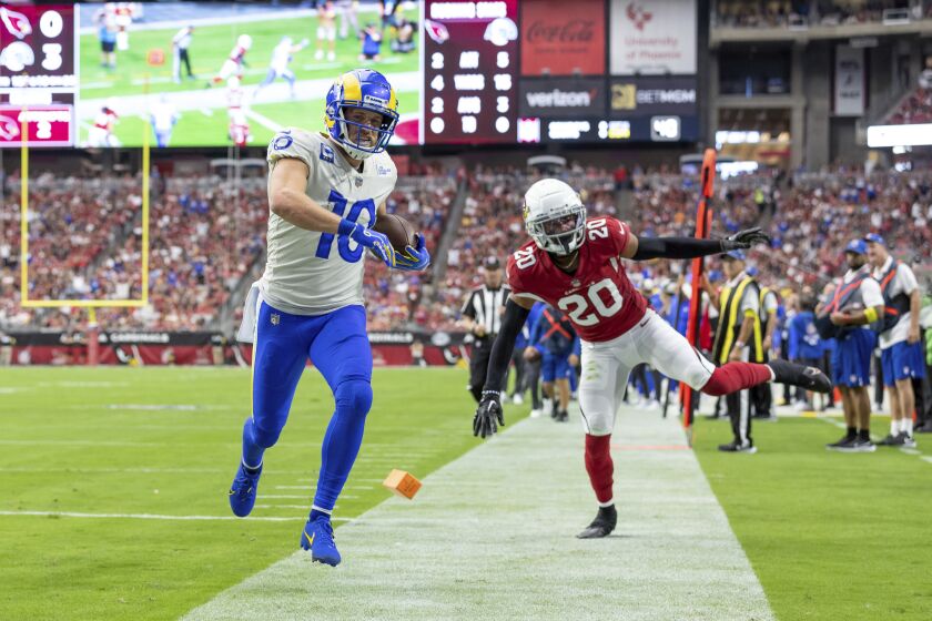 Wide receiver (10) Cooper Kupp of the Los Angeles Rams runs the ball for a touchdown against the Arizona Cardinals in an NFL football game, Sunday, Sept. 25, 2022, in Glendale, AZ. (AP Photo/Jeff Lewis)