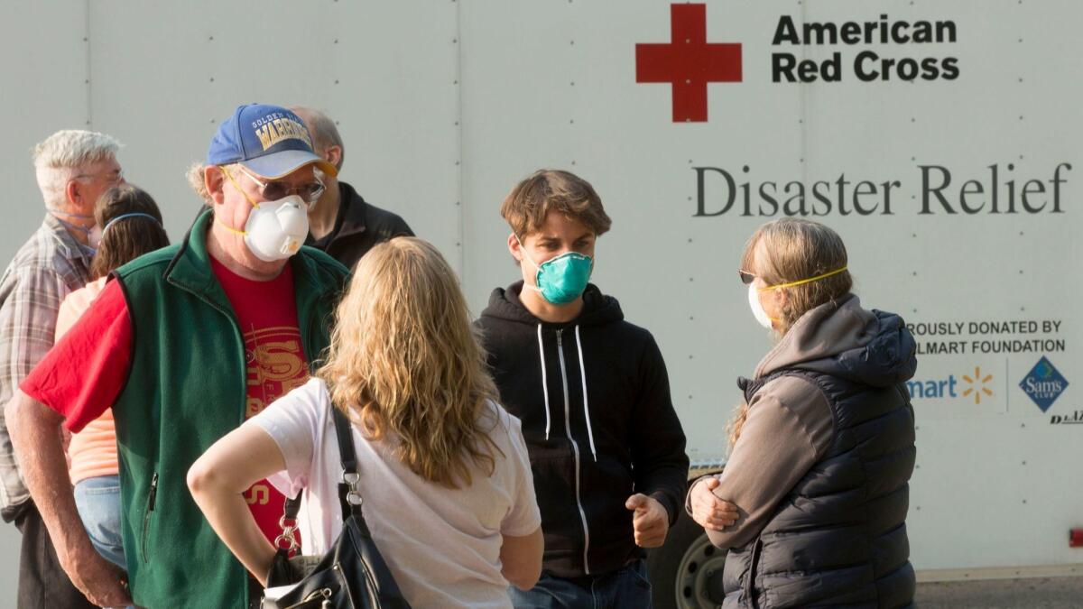 Evacuees gather at the Neighborhood Church shelter in Chico, where a norovirus outbreak was confirmed.