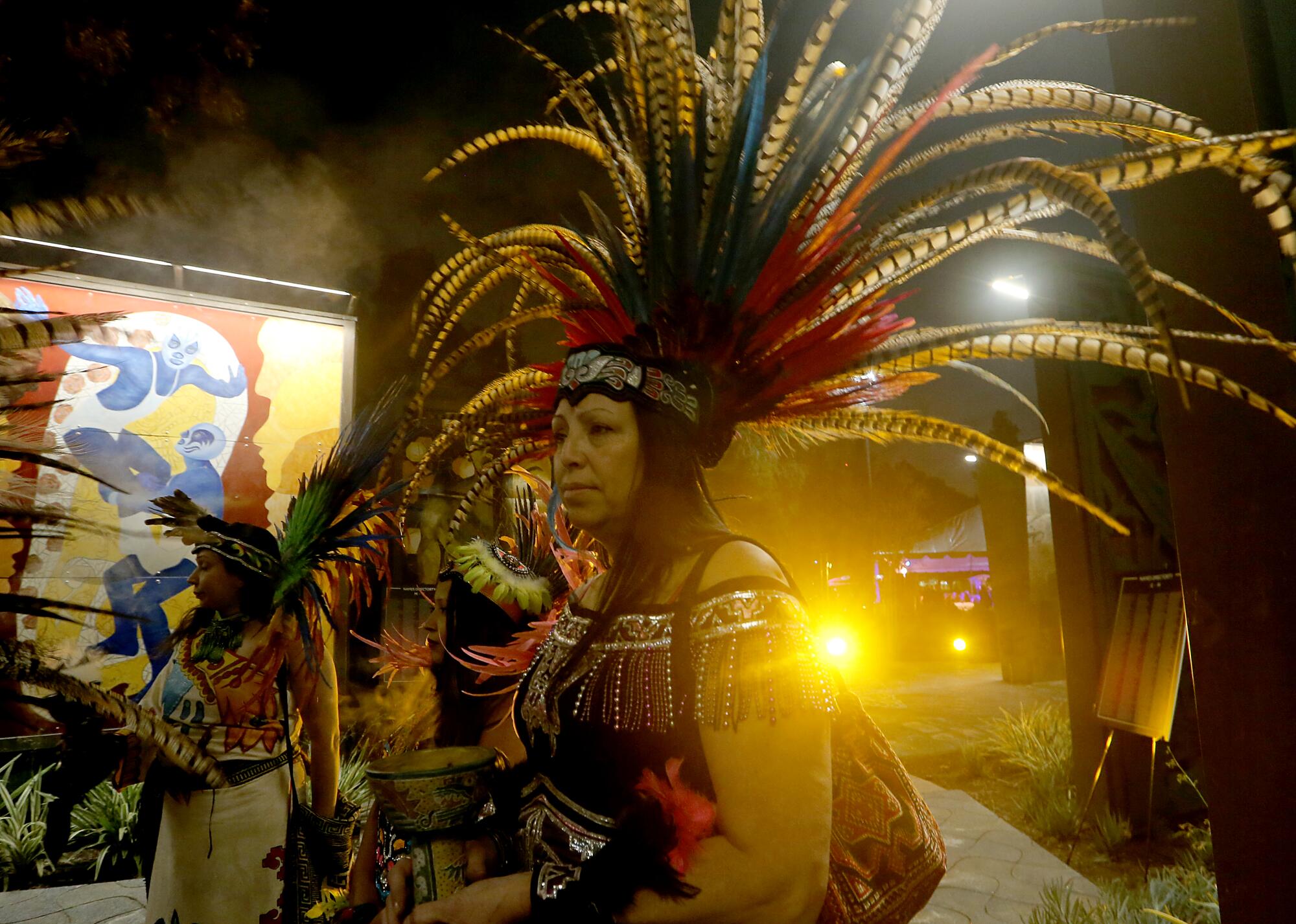 People in colorful headdresses and clothing.