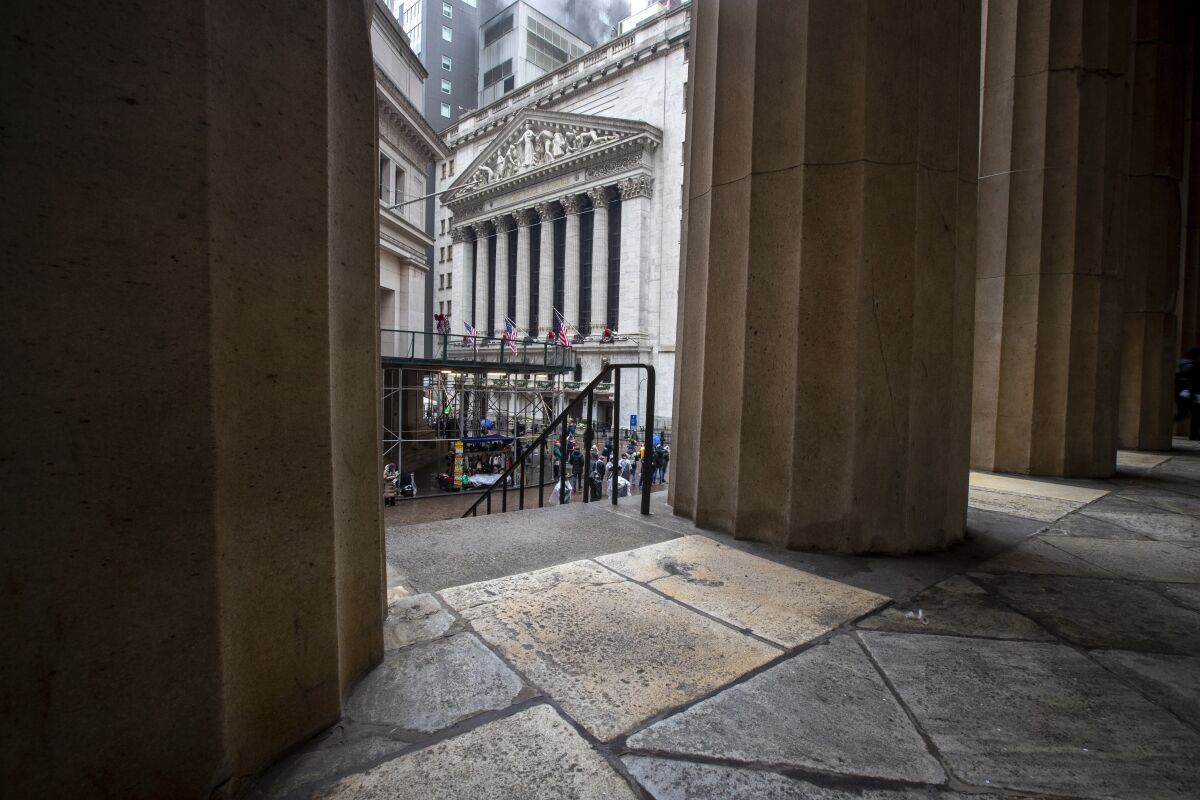 The New York Stock Exchange is framed by the columns at Federal Hall National Memorial.