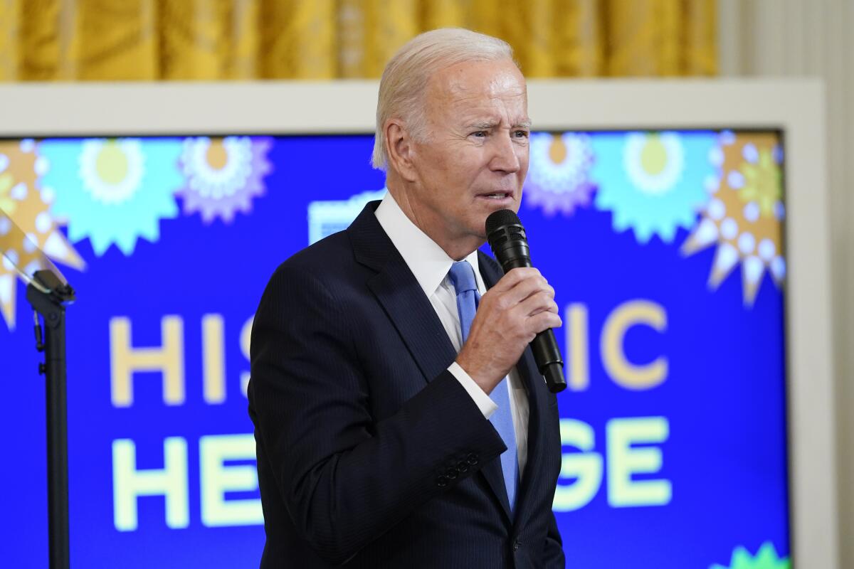 President Joe Biden speaks during a reception in the East Room of the White House for Hispanic Heritage Month.