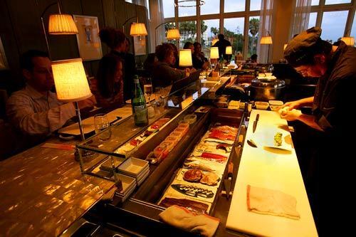 A sushi bar with three chefs occupies the center of the hotel restaurant, a draw for lone diners or travelers on their own.