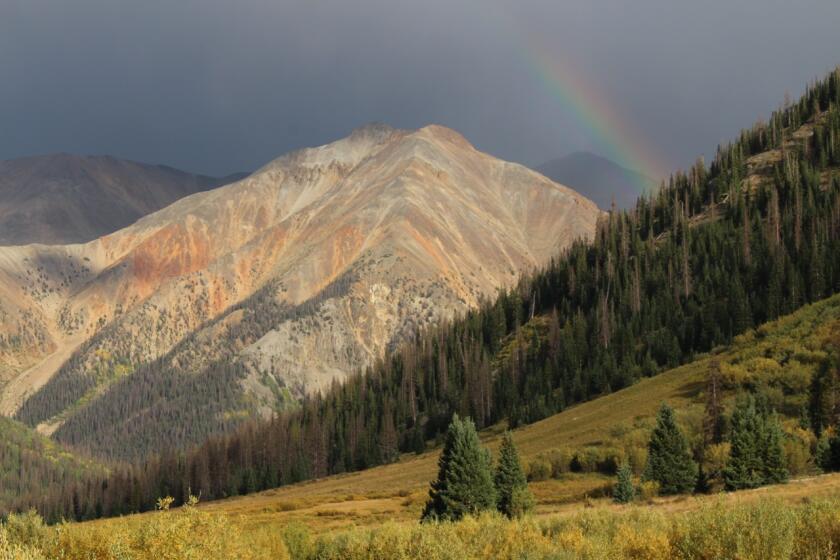 A rainbow arcs over Redcloud Peak, a Colorado "fourteener" that would be designated as wilderness under the Protecting America's Wilderness Act.
