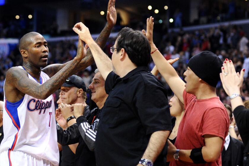 Clippers guard Jamal Crawford, high-fives fans after a victory over the Golden State Warriors in Game 5 of their series.