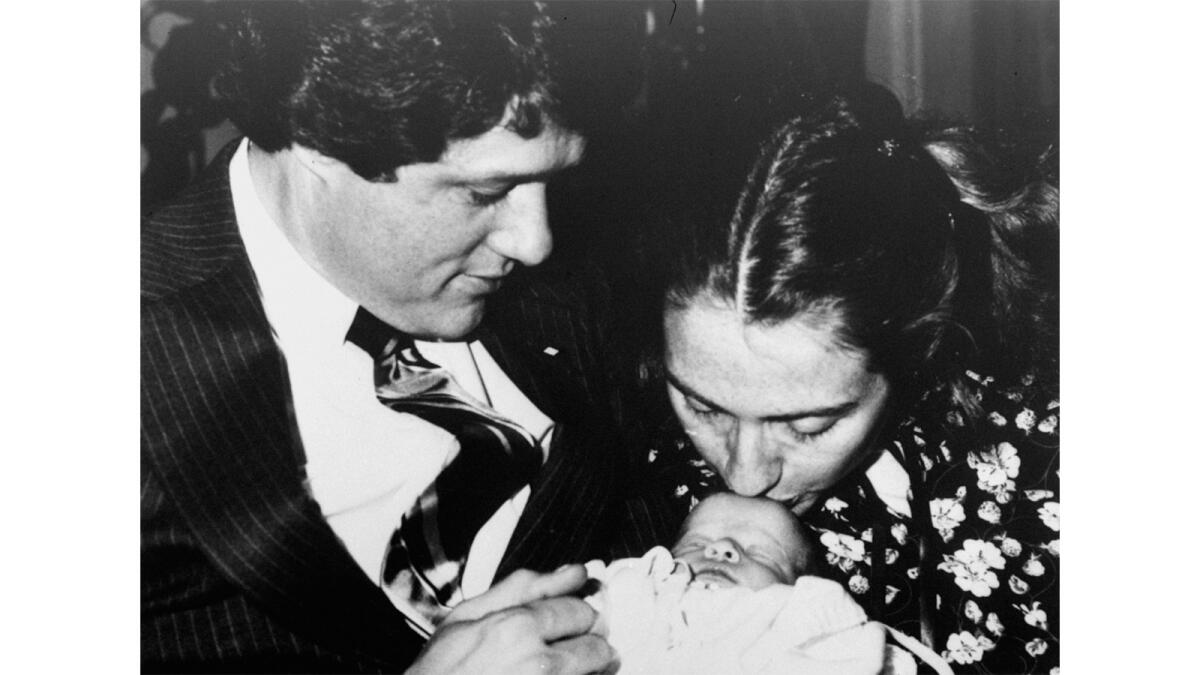 Then-Arkansas Gov. Bill Clinton, Hillary Clinton and week-old baby Chelsea pose for a family picture on March 5, 1980.