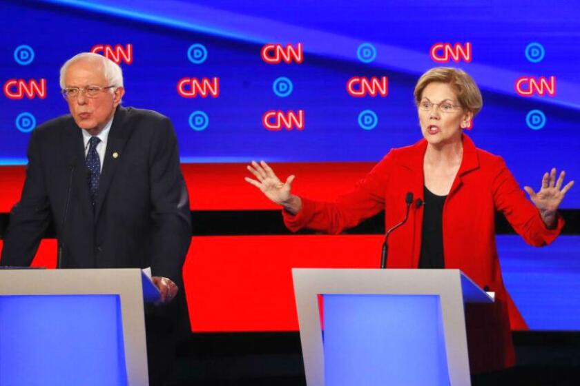 Sens. Bernie Sanders and Elizabeth Warren participate in Tuesday's Democratic debate.