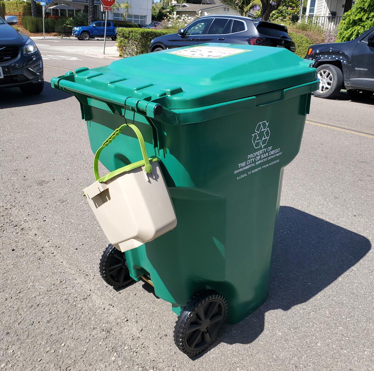 A green bin and kitchen pail that had just been delivered in La Jolla Shores.