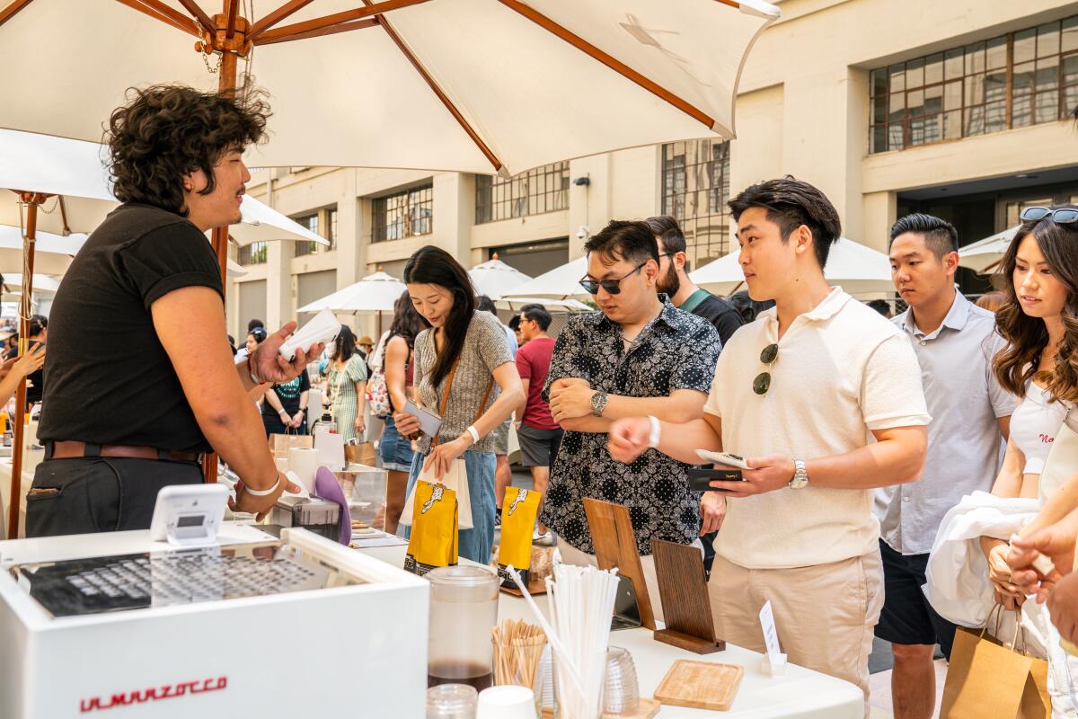 People shopping at an outdoor market.