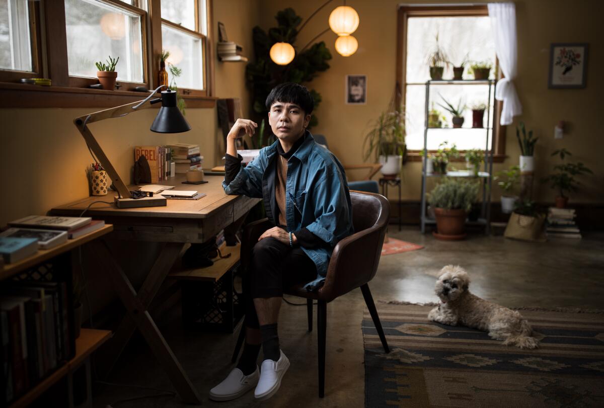 Ocean Vuong and his dog, Tofu, at home.