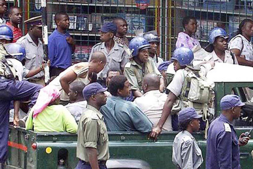 Movement for Democratic Change members bound for a protest against President Robert Mugabe's regime are arrested in Harare, Zimbabwe. Gift Tandare, 41, was slain. Mugabe wants to extend his term. (March 11, 2007)