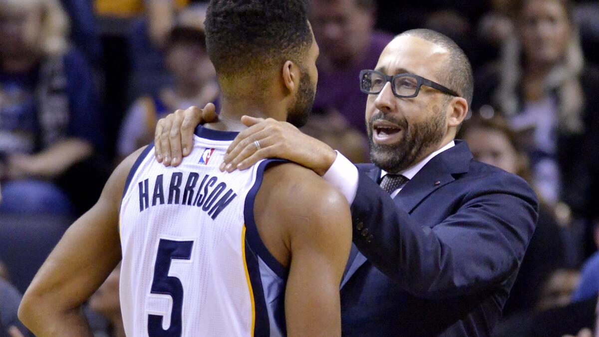 Grizzlies Coach David Fizdale and guard Andrew Harrison during a game against the Warriors.