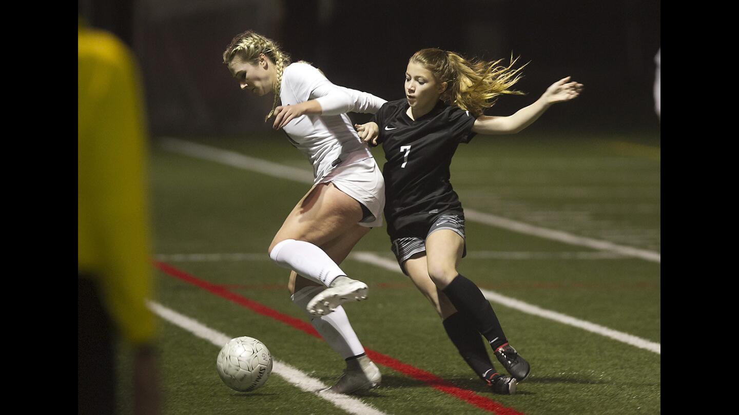 Sage Hill's Grace Robinson-Dorn, right, steals the ball from St. Margaret's Lauren McCaffry near the sideline in girls varsity soccer action at St. Margaret's, Friday evening.