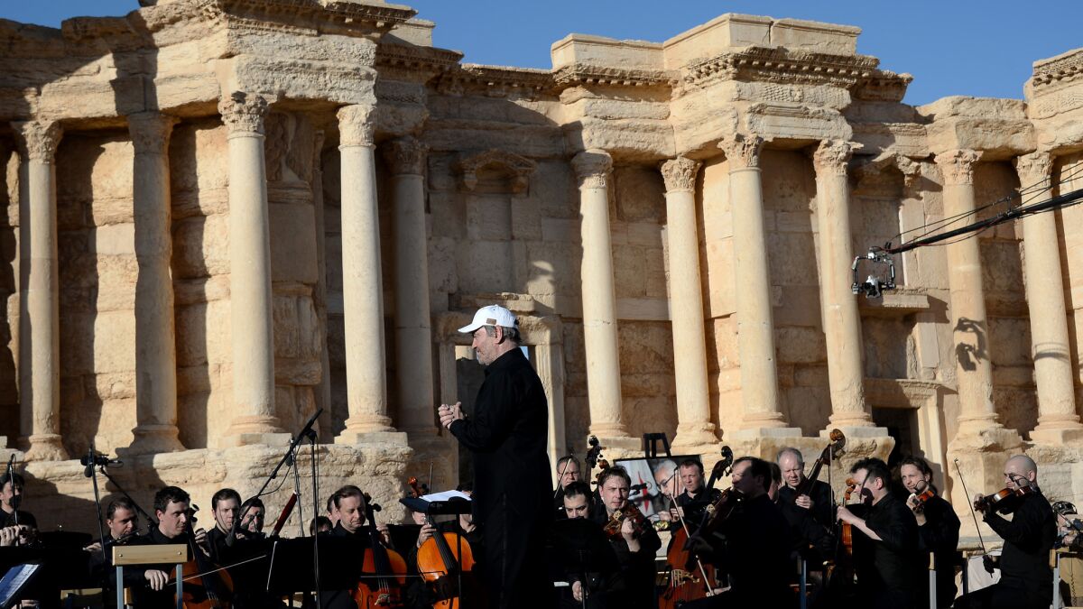 The Mariinsky Symphony Orchestra performs in the Roman theater in Palmyra, Syria.