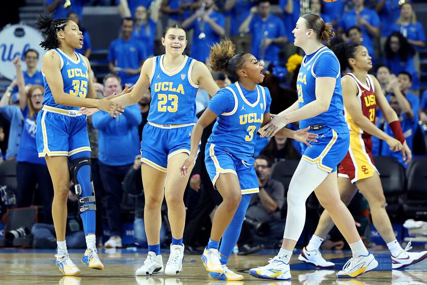 LOS ANGELES-CA-DECEMBER 30, 2023: UCLA Women's basketball team celebrates their win over USC.