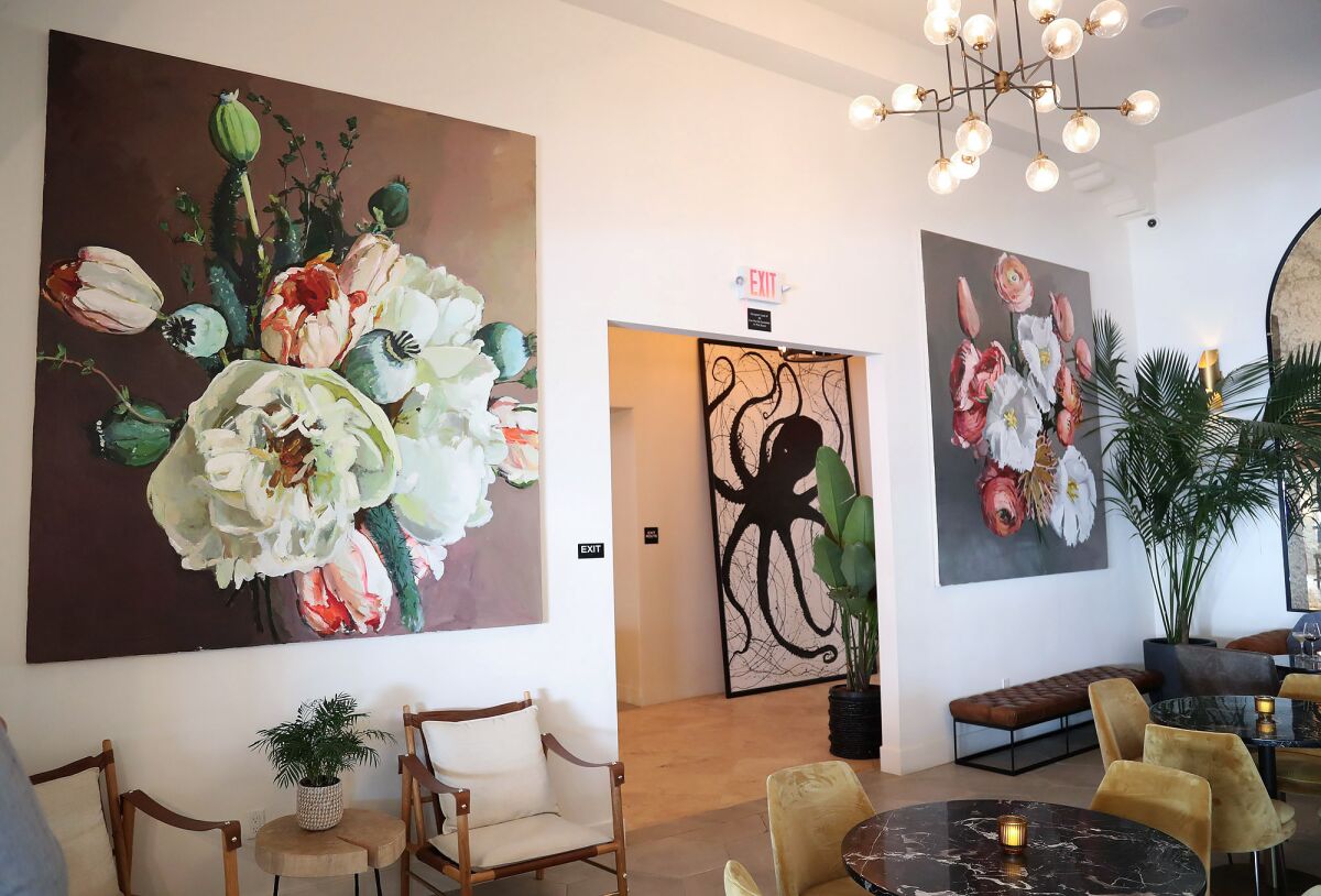 Art from local artists adorn the new bar lounge area at the Hotel Laguna.