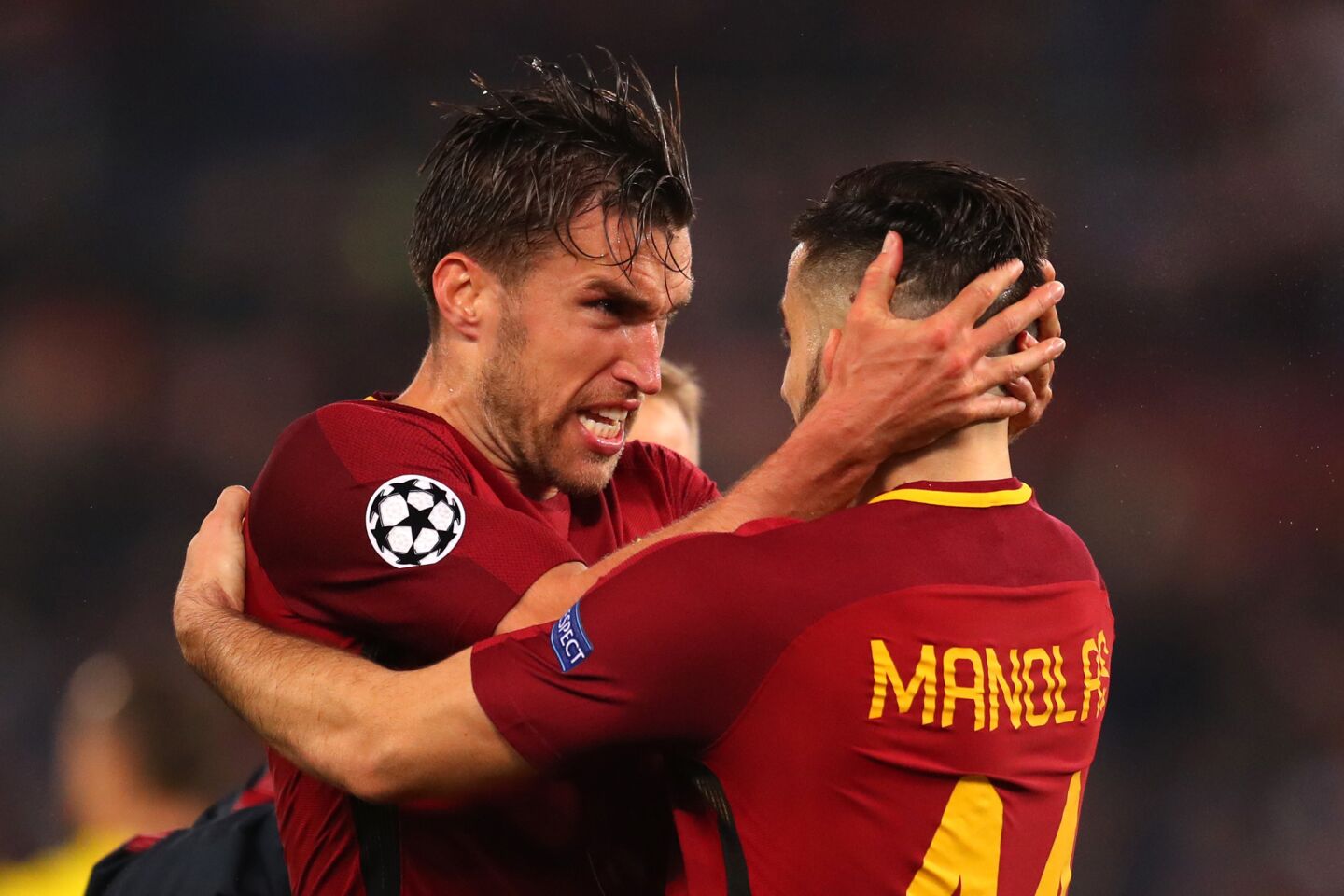 ROME, ITALY - APRIL 10: Kevin Strootman of AS Roma and Kostas Manolas of AS Roma celebrate at the full time whistle during the UEFA Champions League Quarter Final Second Leg match between AS Roma and FC Barcelona at Stadio Olimpico on April 10, 2018 in Rome, Italy.