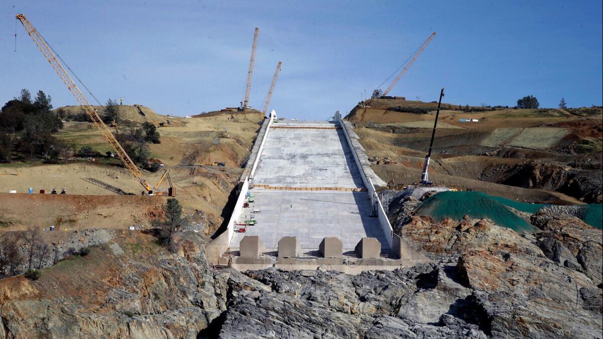 In this Nov. 30, photo, work is shown continuing on the Oroville Dam spillway in Oroville, Calif.