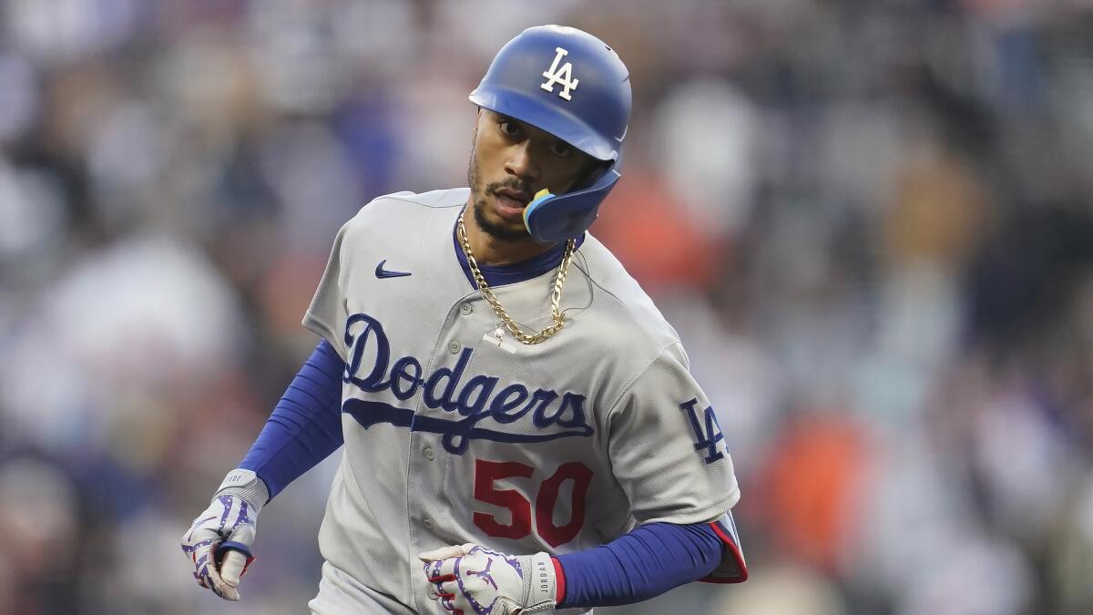 Dodgers center fielder Mookie Betts runs the bases against the San Francisco Giants on Tuesday.