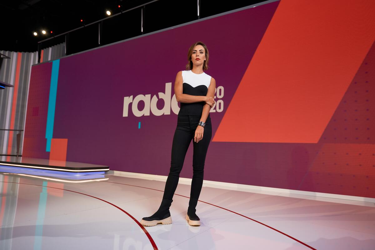 Gabriela Fresquez stands on the set of her show "Radar 2021."