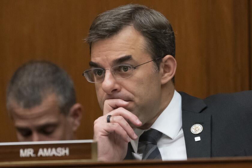 FILE - In this June 12, 2019 file photo, Rep. Justin Amash, R-Mich., listens to debate as the House Oversight and Reform Committee considers whether to hold Attorney General William Barr and Commerce Secretary Wilbur Ross in contempt for failing to turn over subpoenaed documents related to the Trump administration's decision to add a citizenship question to the 2020 census, on Capitol Hill in Washington. Amash, the only Republican in Congress to support the impeachment of President Donald Trump, said Thursday, July 3 he is leaving the GOP because he has become disenchanted with partisan politics and "frightened by what I see from it." (AP Photo/J. Scott Applewhite, File )